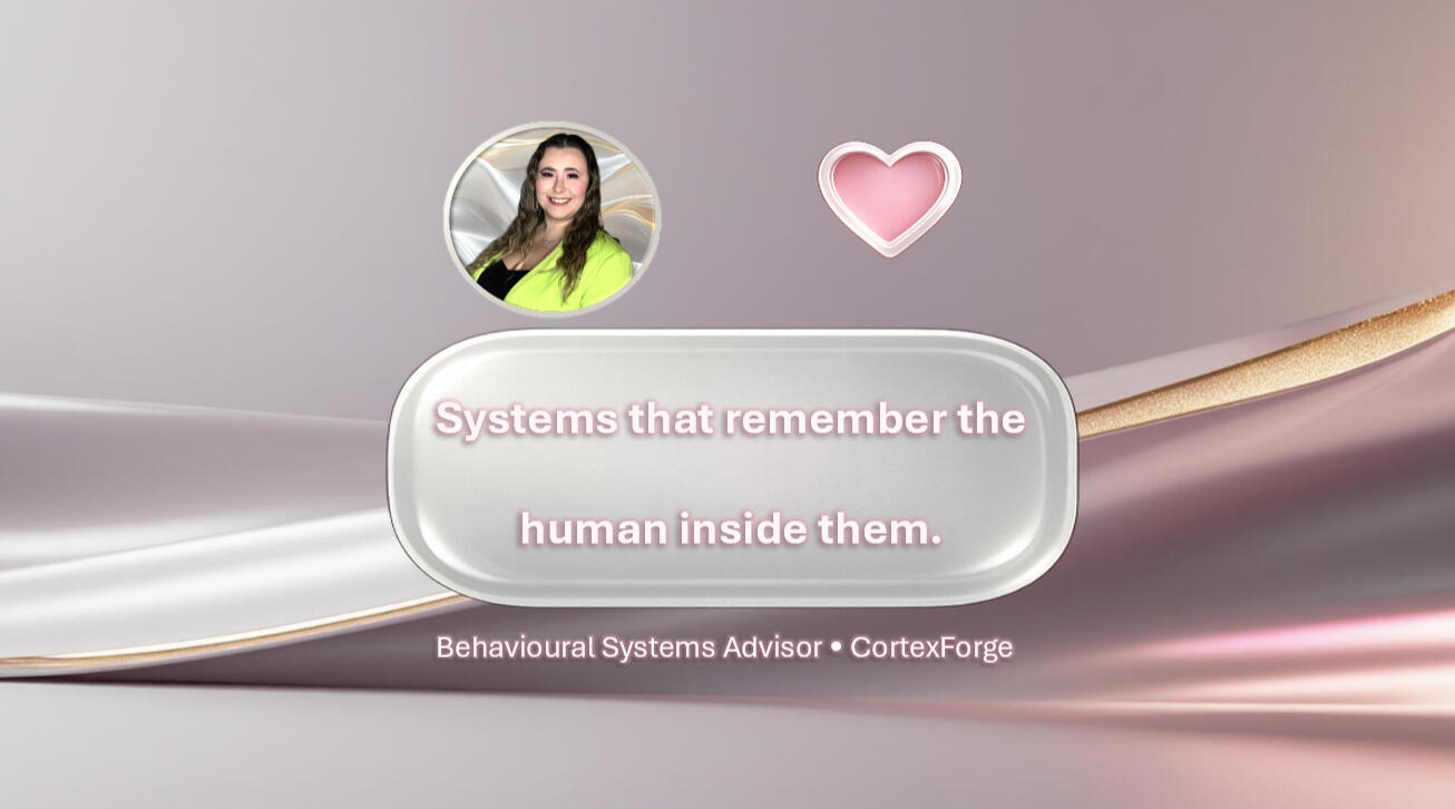 CortexForge Library — Behavioural Systems Advisor Quote Card on Human-Centered Design A soft pink and pearl-toned graphic with a circular portrait of a woman, a heart icon, and a central glass-like panel displaying the quote, “Systems that remember the human inside them.” Text below reads, “Behavioural Systems Advisor • CortexForge.”